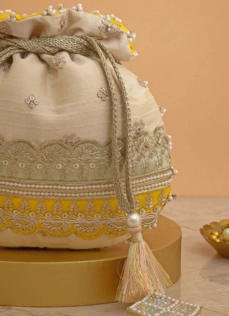 Amyra Beige Silk Potli With Mint Green And Yellow WorkShop Jashn