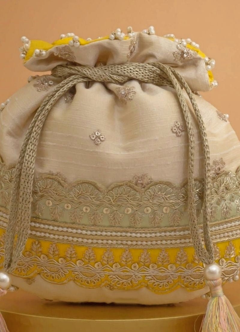 Amyra Beige Silk Potli With Mint Green And Yellow WorkShop Jashn