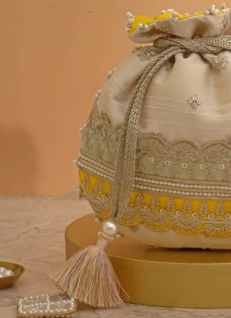 Amyra Beige Silk Potli With Mint Green And Yellow WorkShop Jashn
