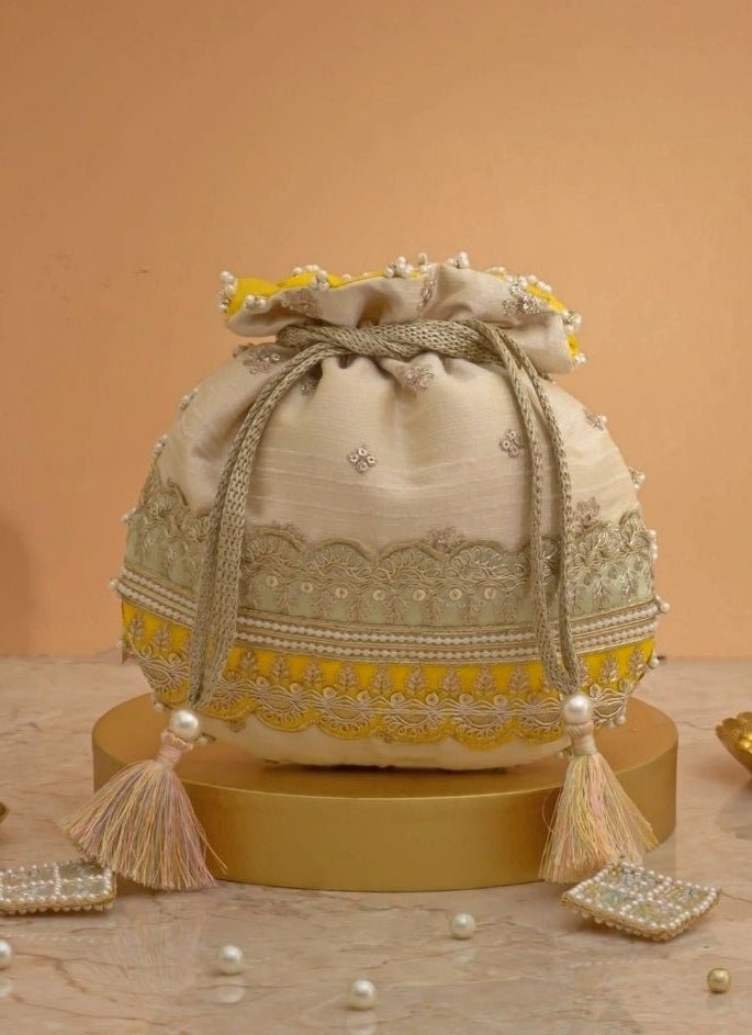 Amyra Beige Silk Potli With Mint Green And Yellow WorkShop Jashn