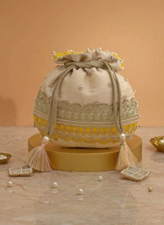 Amyra Beige Silk Potli With Mint Green And Yellow WorkShop Jashn