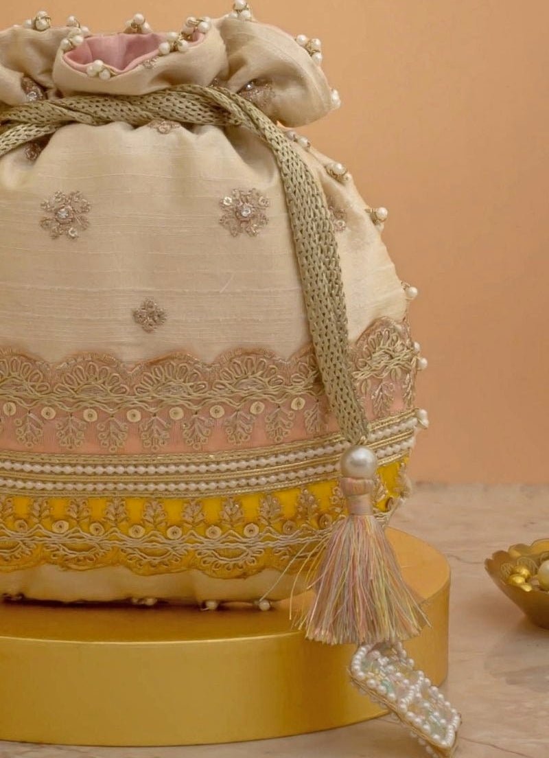 Amyra Beige Silk Potli With Pink And Yellow WorkShop Jashn
