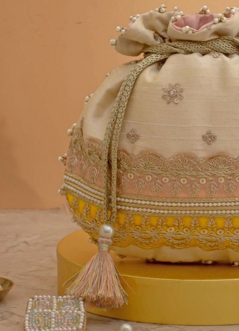 Amyra Beige Silk Potli With Pink And Yellow WorkShop Jashn