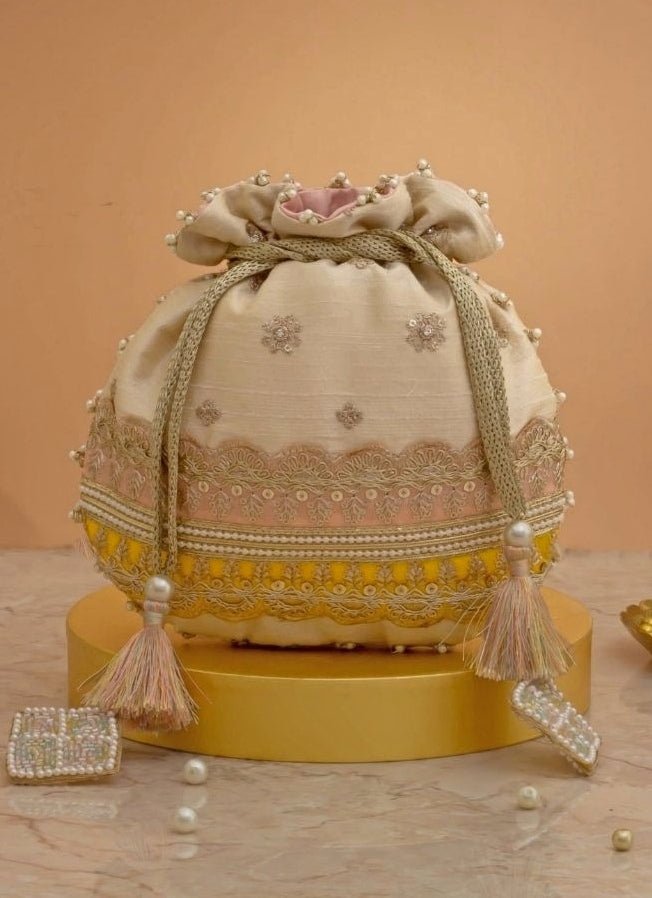 Amyra Beige Silk Potli With Pink And Yellow WorkShop Jashn