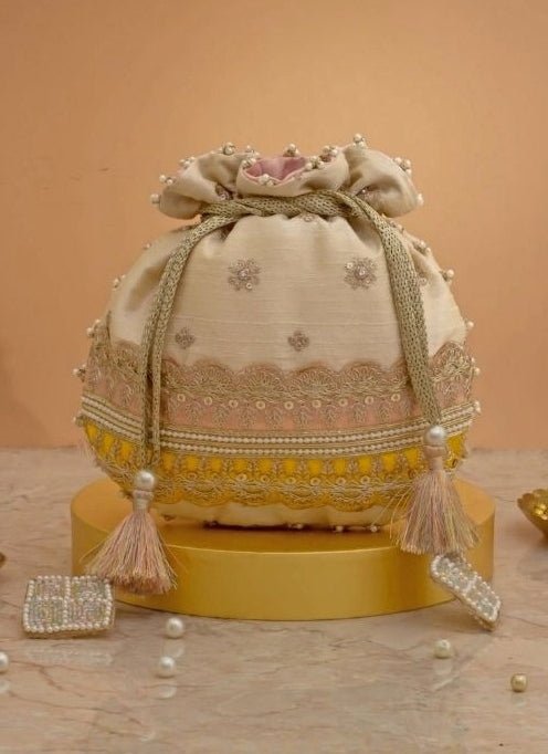 Amyra Beige Silk Potli With Pink And Yellow WorkShop Jashn
