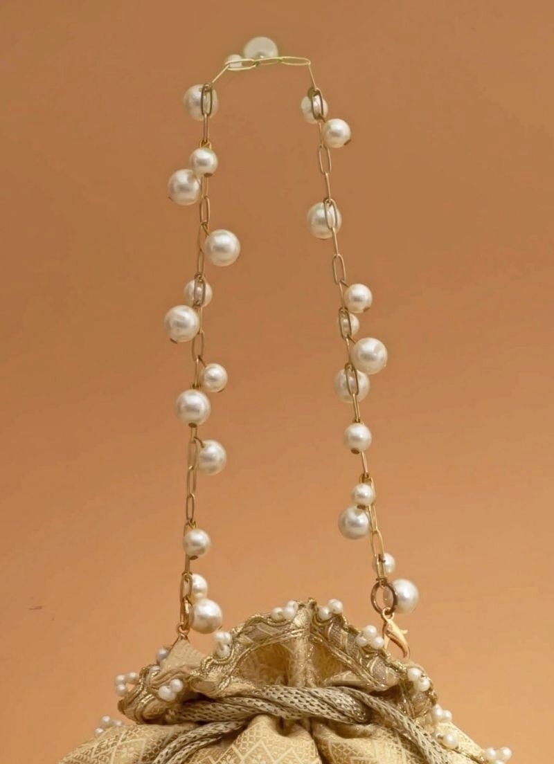Amyra Cream Silk Embroidered PotliShop Jashn