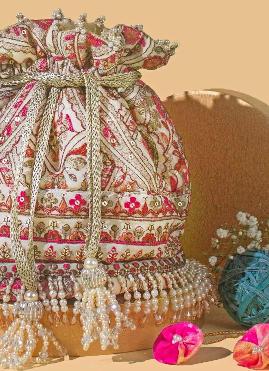 Amyra Ivory Embroidered Georgette PotliShop Jashn