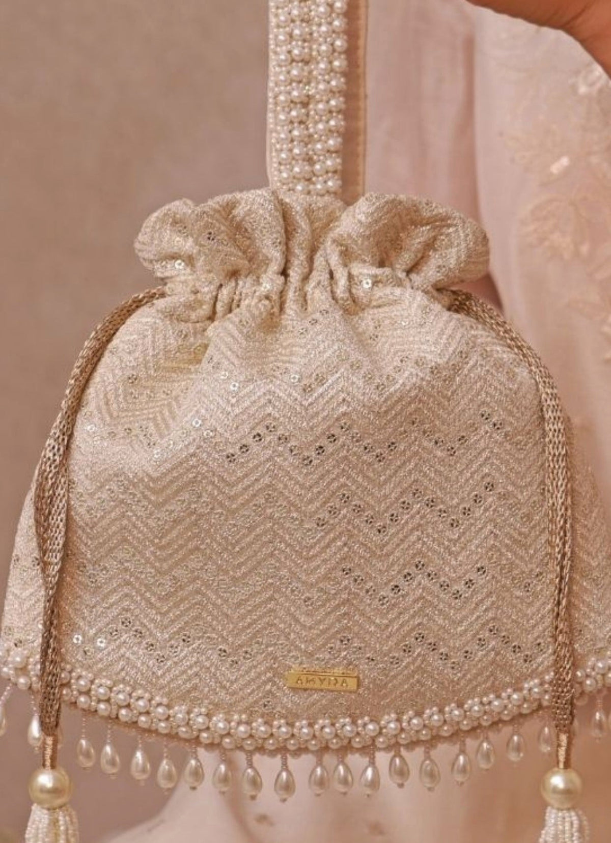 Amyra Ivory Embroidered PotliShop Jashn