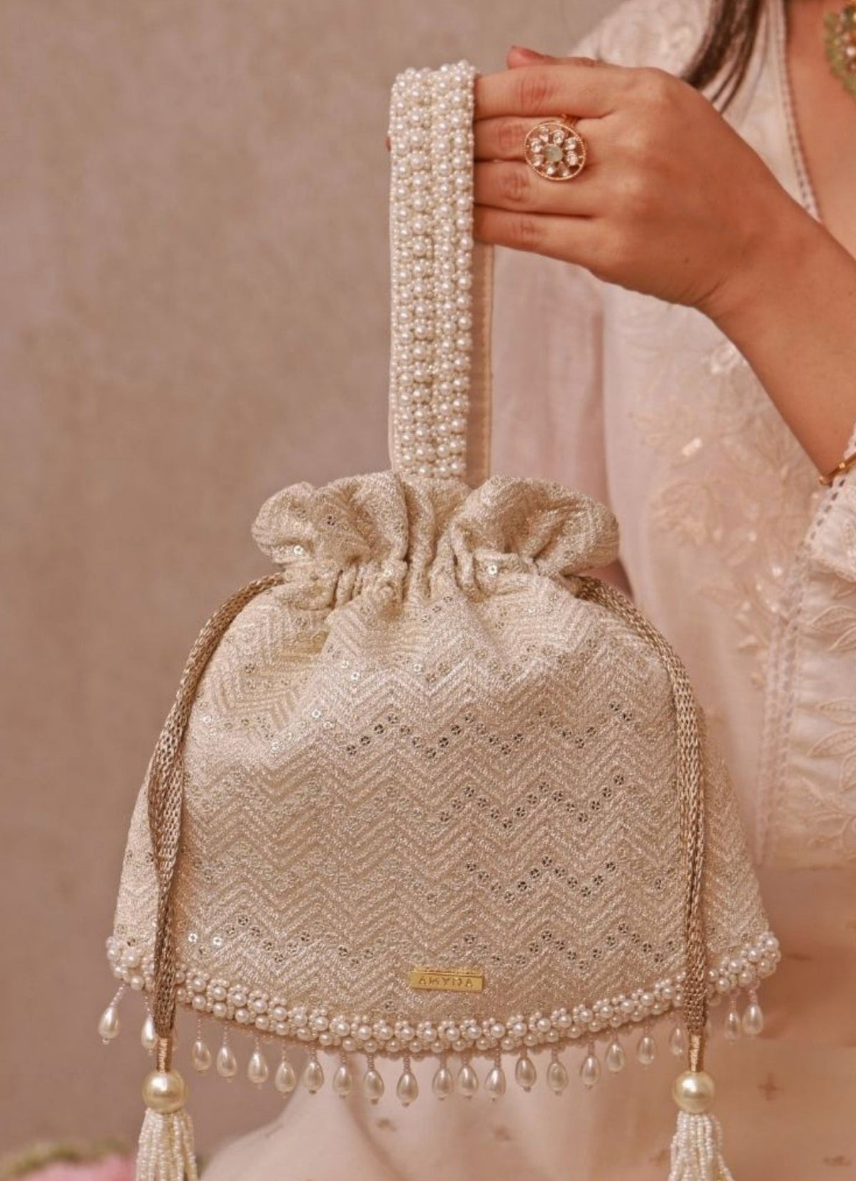 Amyra Ivory Embroidered PotliShop Jashn