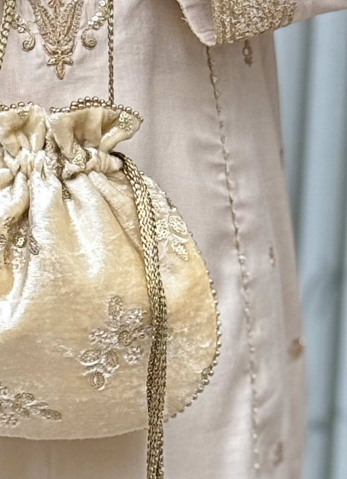 Amyra Ivory Embroidered Velvet PotliShop Jashn